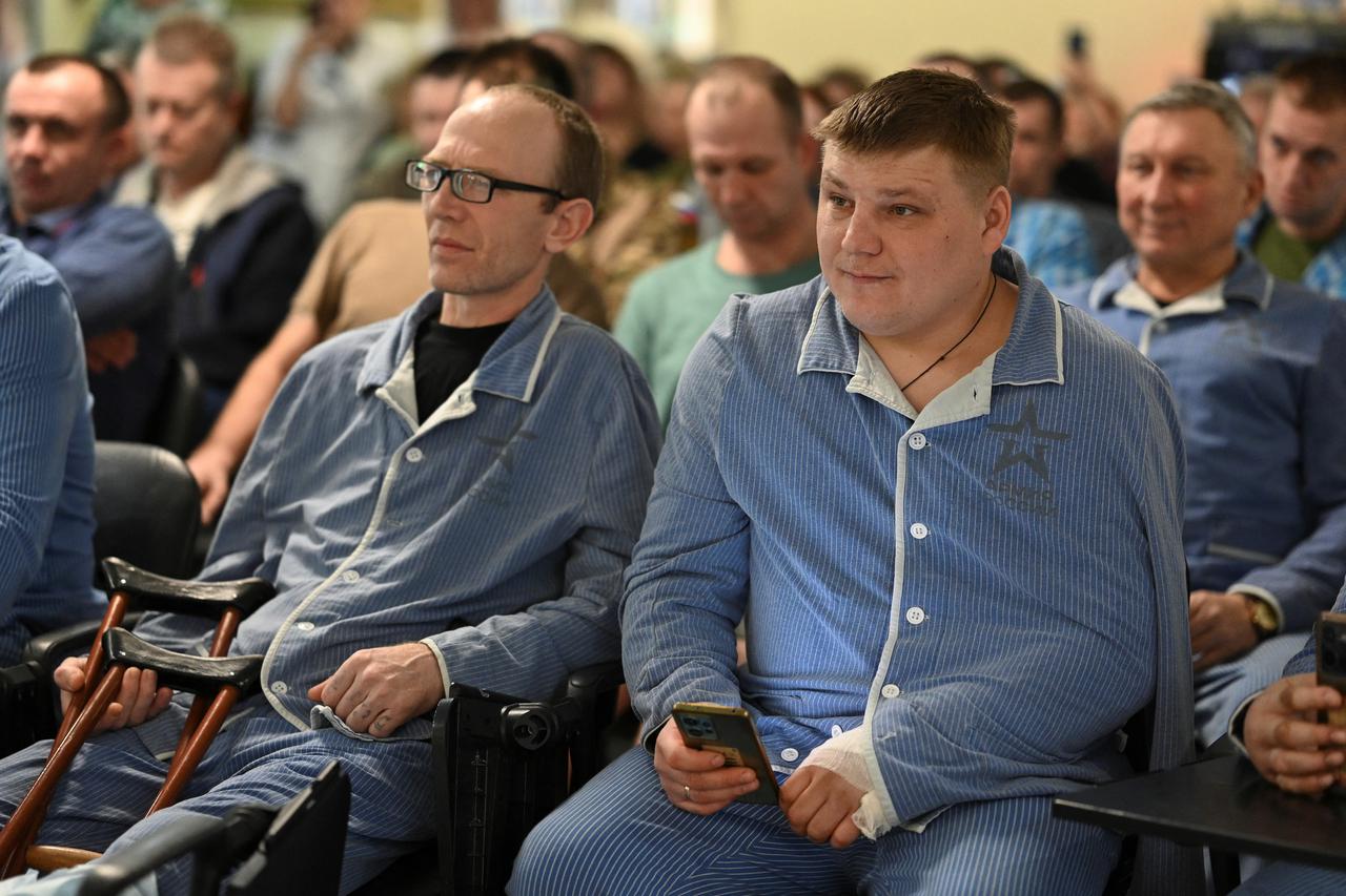 Russian wounded soldiers attend a concert at a hospital in Rostov-on-Don
